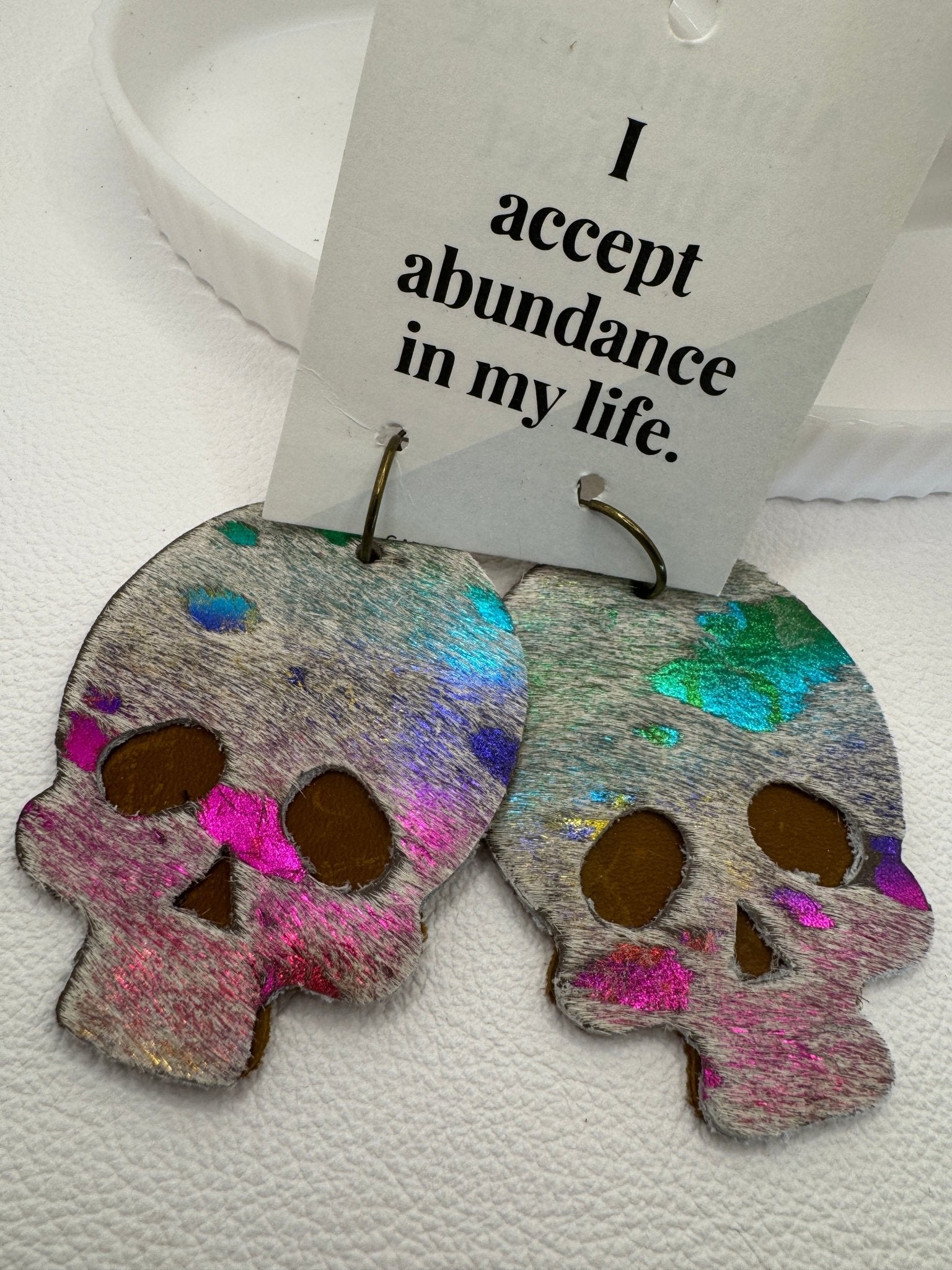 Metallic Rainbow Hair on Hide Skull Earrings - Jagged Leather Handmade Jewelry